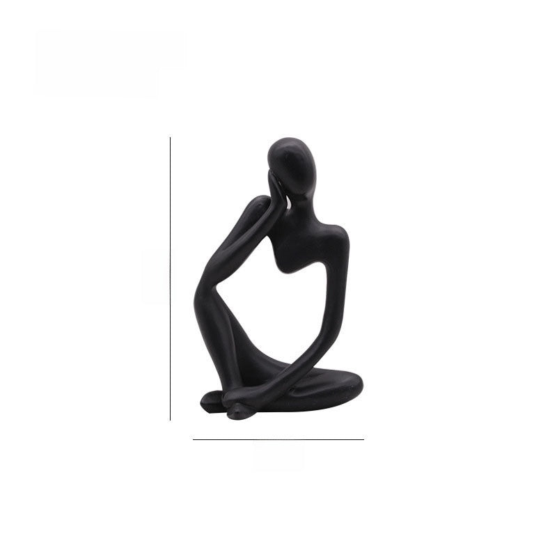 Speckled sandstone abstract resin meditator figurine in a seated contemplative pose