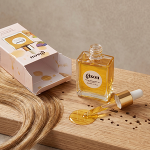 Front view of the honey-toned hair nourishing oil 20ml bottle