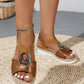 Brown wedge hemp sandal with silver ring and peep toe on a round woven mat