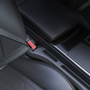 Car seat gap filler sealing the slot between seat and console