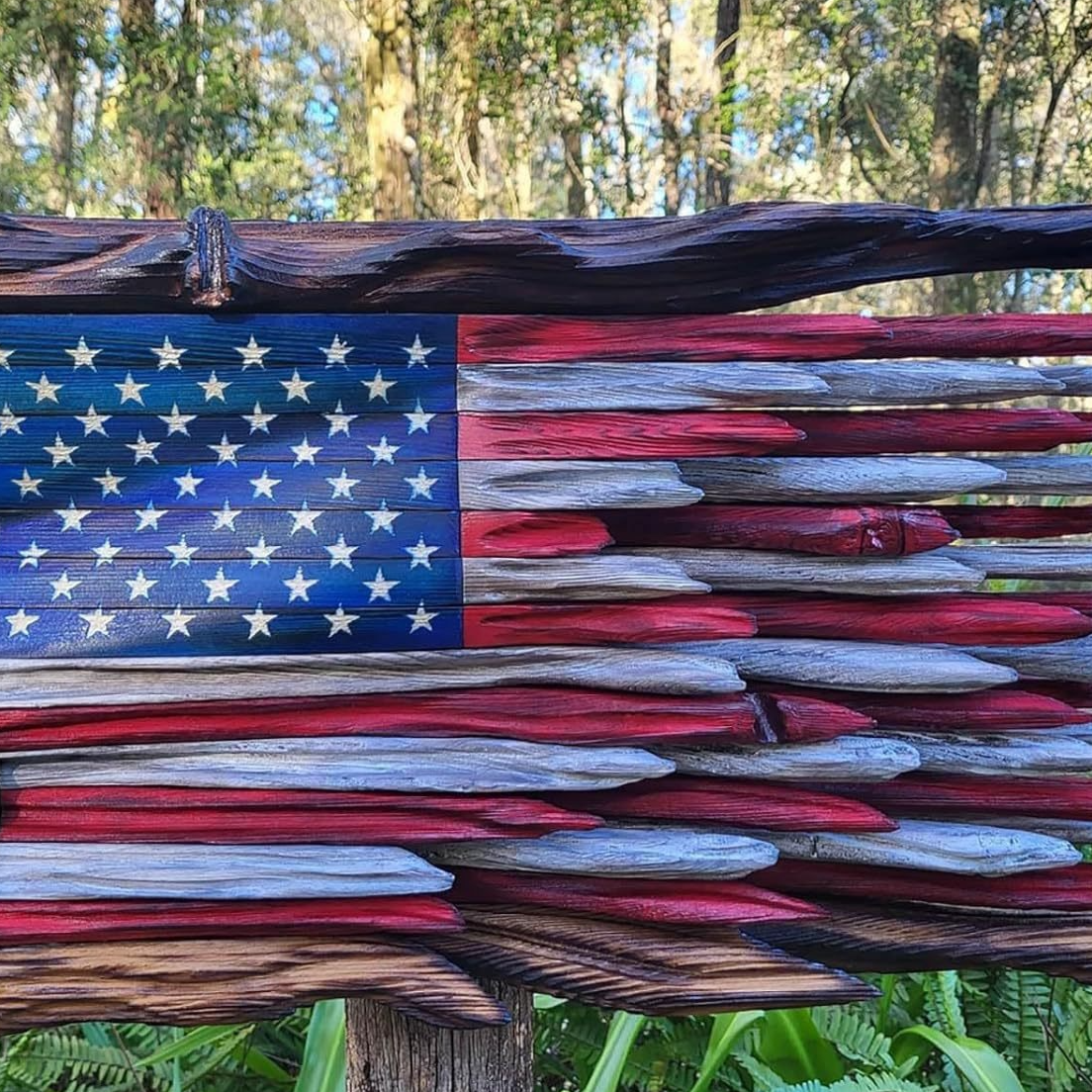 Carved wooden American flag wall art with a burnt edge rustic frame