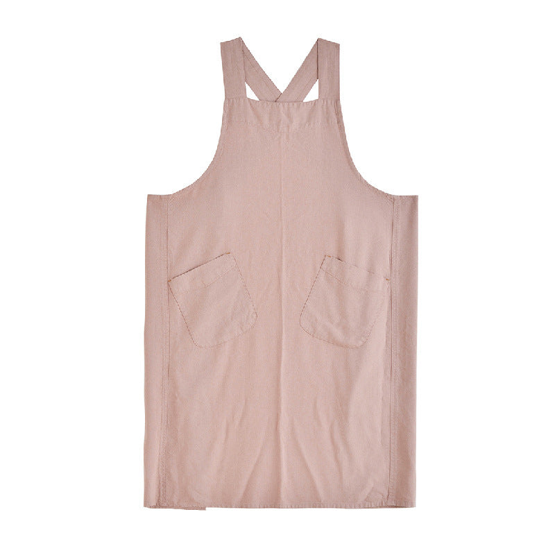 Towel tucked through the side loop of the apron at the hip