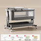 Gray baby crib with a gray frame and a nursing table on top, Nursing model shown, dark gray option