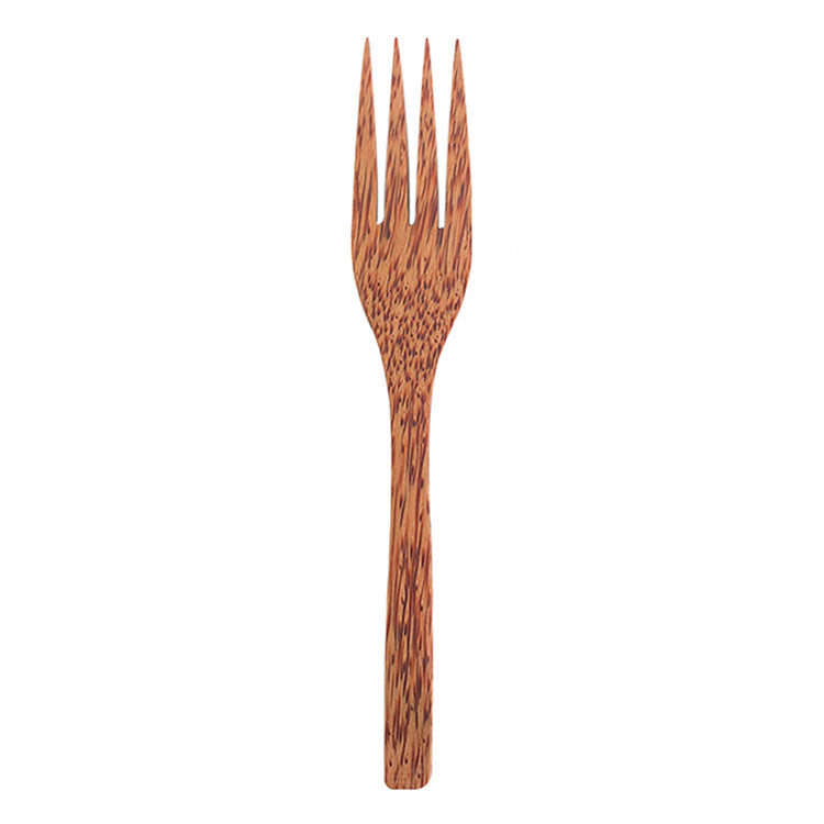 Coconut wood fork with a speckled grain on a white background, fork option photo