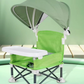 Green folding baby feeding chair with a green canopy and a white removable tray