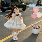 Apricot girls puffy ball gown dress, front view of fitted bodice and full skirt