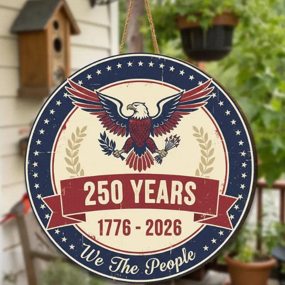 Wooden patriotic plaque under soft studio lighting on plain backdrop
