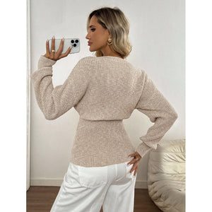 Apricot ribbed knit V neck cardigan with gold buttons worn open over white trousers