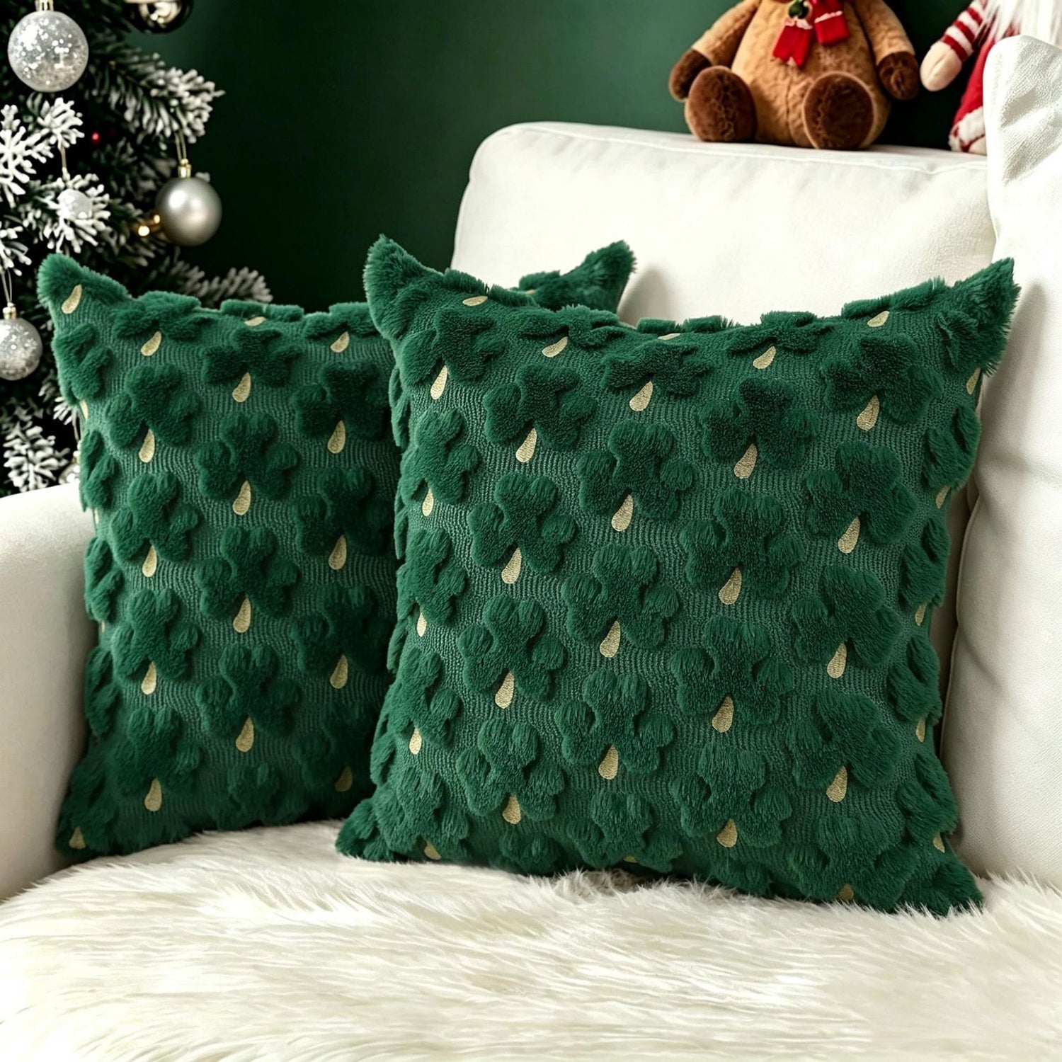 Plush carved cushion cover with gold flecked clovers on a deep green plush ground