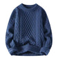 Cable twist knit crewneck sweater shown flat with a loose relaxed body and ribbed hem