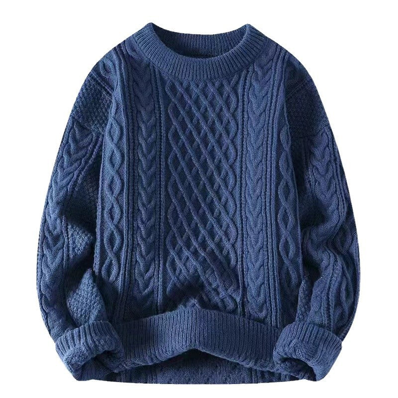 Cable twist knit crewneck sweater shown flat with a loose relaxed body and ribbed hem