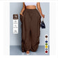 High waist wide leg linen look viscose drawstring trousers, front view on a model with hands in the deep pockets