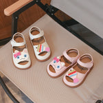 Cartoon baby soft sole sandals in pink, front view of the rounded cartoon toe