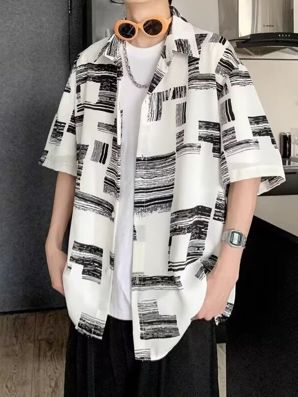 Loose short sleeve print shirt shown from the front, buttons running collar to hem