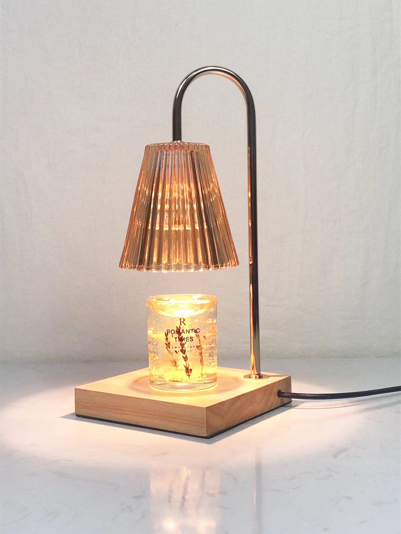 Aromatherapy candle warmer lamp lit in a dim room