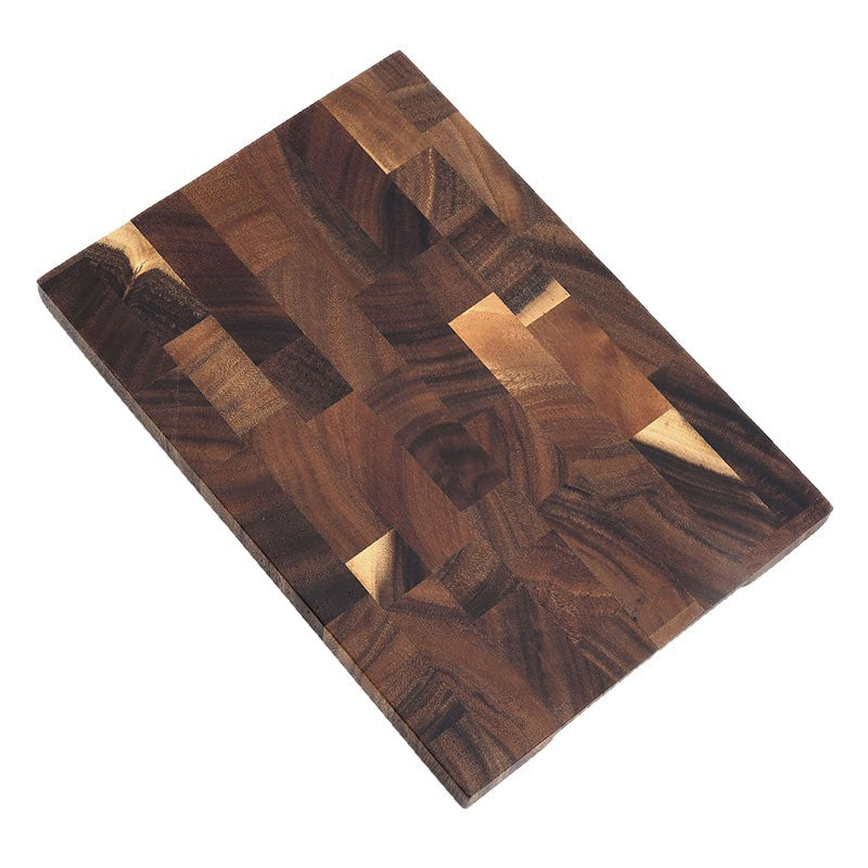 Angled view of the rectangular walnut end grain board on a plain white background