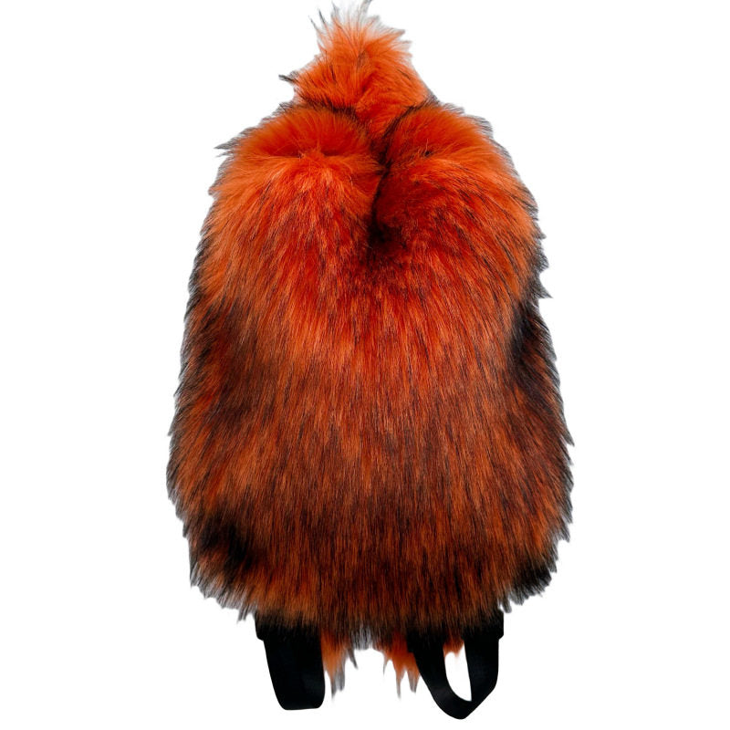 Plush fur travel backpack shown with its packaging and contents
