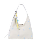 Detail of the bucket bag stitching, hardware and clean finish up close