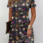 Relaxed floral print tee dress with round neck worn on a model in daylight