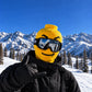 Building Man Mask 4 option: yellow block head face cover with a small smile, worn with ski goggles