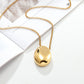 Close up of drop pendant and plated chain links detail