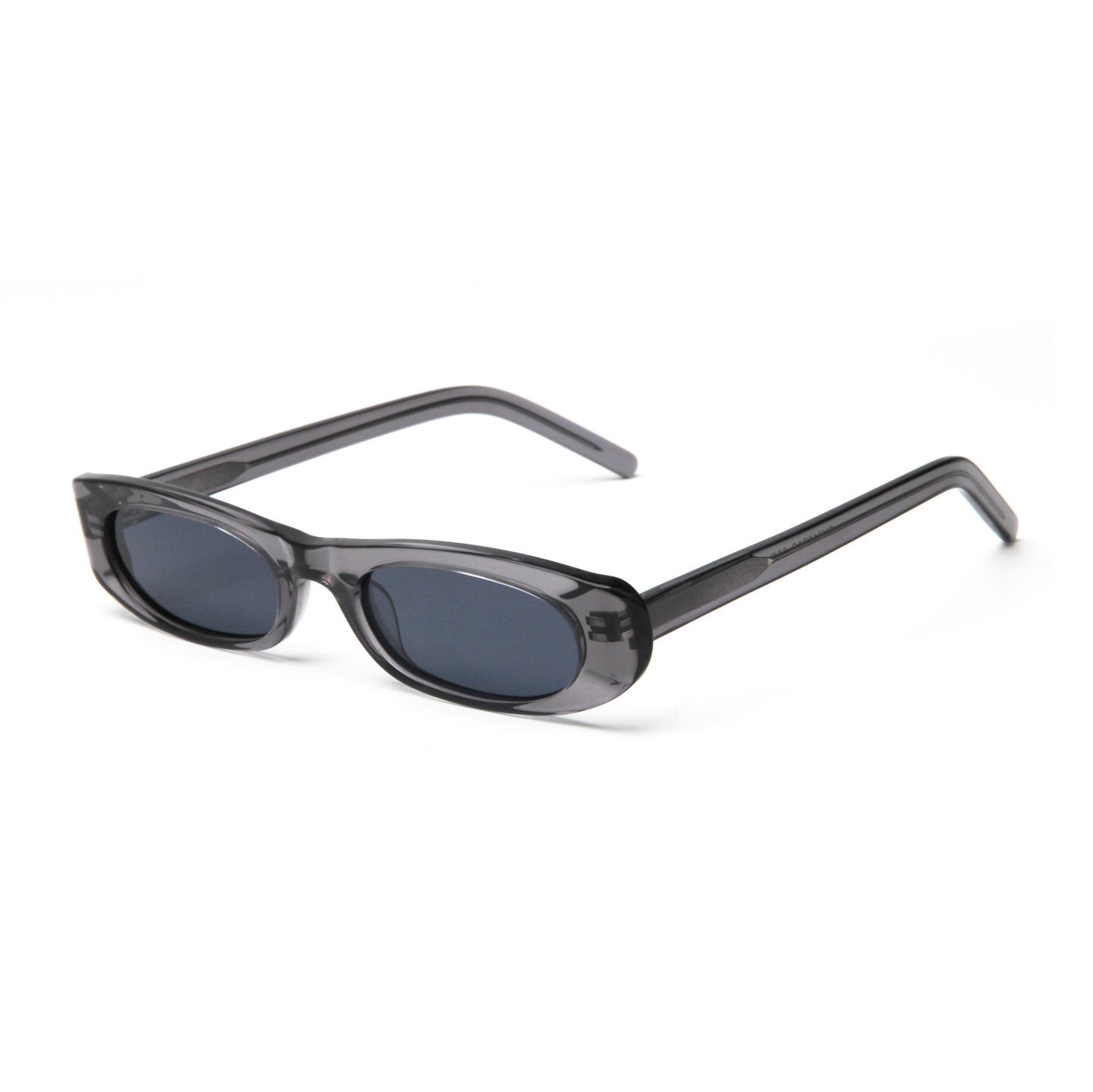 Translucent grey acetate slim oval sunglasses with dark polarized lenses, angled view