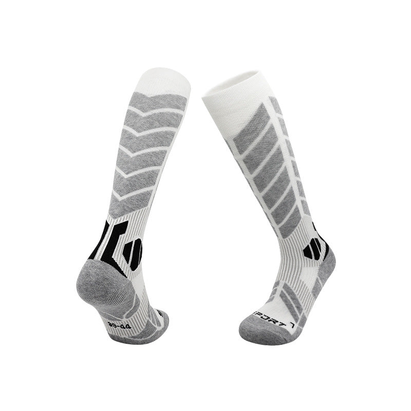 Sport ski socks knit with contrast panels and a plush cushioned sole on a white ground
