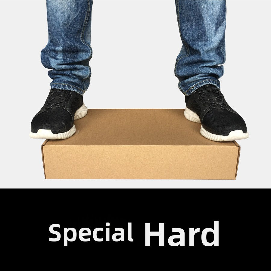 Kraft cardboard shoe box with a person in jeans and black sneakers standing on the closed box