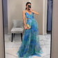 Mesh print sling maxi dress shown at an angle to show the printed fabric