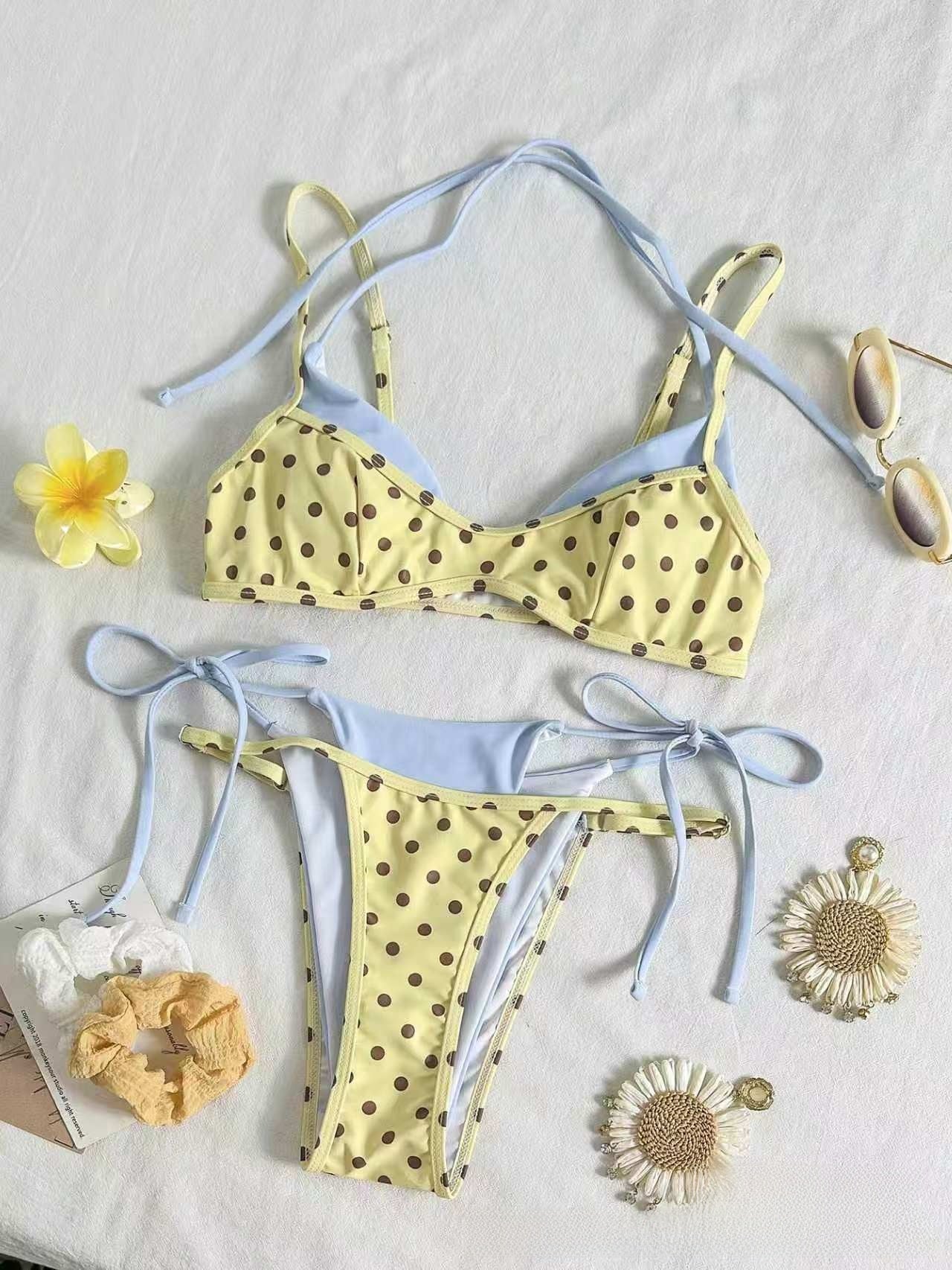Brown ground polka dot bikini worn outdoors, triangle top on straps with tie side bottoms