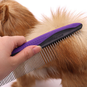 Stainless steel pin pet comb with a curved soft grip handle shown close up