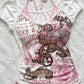 White combed cotton halter tee with a beaded baroque graphic and gothic lettering