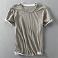 Light gray washed slub cotton short sleeve tee with dropped raw hem, front flat lay, size XL
