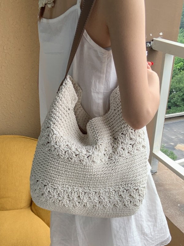 Off-white crochet shoulder bag with open floral weave bands