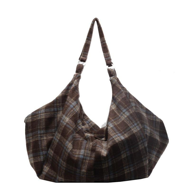 Coffee brown woolen plaid shoulder tote bag shown with its long adjustable strap