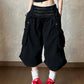 Black cotton wide leg cropped cargo pants with a high double row waistband on a model