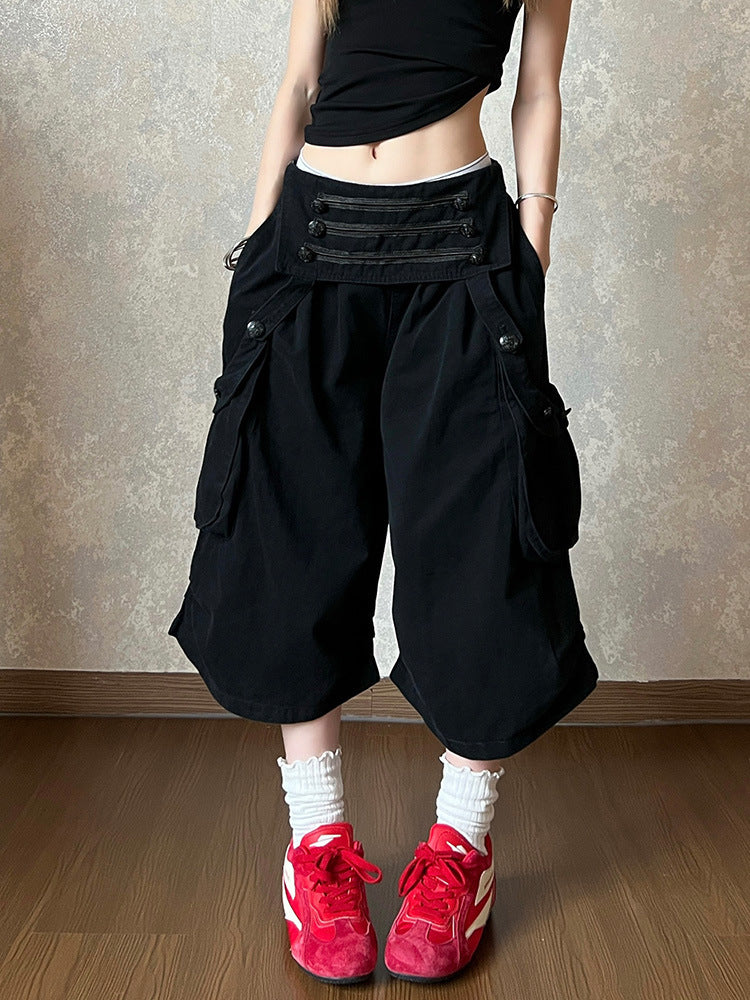 Black cotton wide leg cropped cargo pants with a high double row waistband on a model