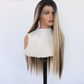 Three quarter front view of a long straight mixed blonde and brown lace front wig on a mannequin with a ribbed top