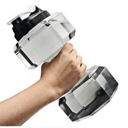 Translucent PET dumbbell shaped sports water bottle held in one hand like a hand weight