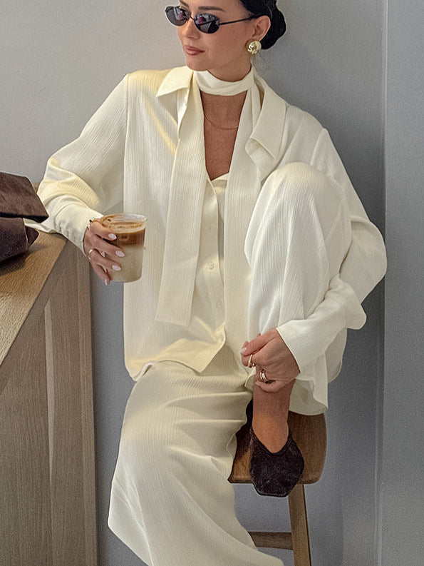 Front view of the buttercream long sleeve shirt and wide leg trousers two piece set on a woman