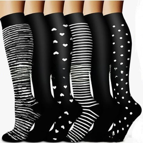 Assorted print knee high compression sport socks laid out side by side