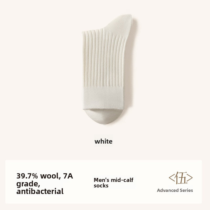 Merino wool blend mid calf socks in a solid color, folded pair on a plain background