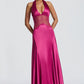 Black satin halter maxi gown seen from the side showing the flared floor length skirt