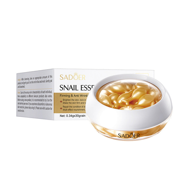 Snail essence capsules in a jar next to the product box, angled view