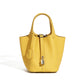 Leather bucket tote bag shown from an alternative front angle