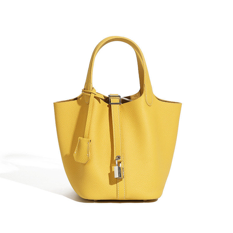 Leather bucket tote bag shown from an alternative front angle