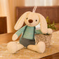 Cream plush rabbit in a mint striped top and slate suspender shorts beside a planter, Green 60cm option