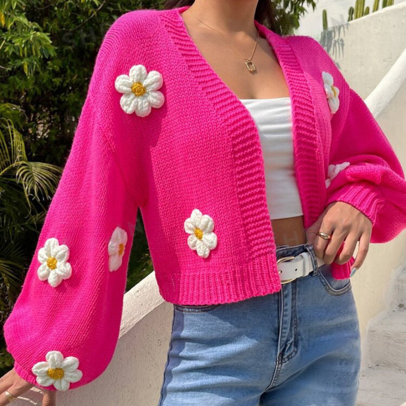 Three quarter view of the floral lantern sleeve knit cardigan on a model