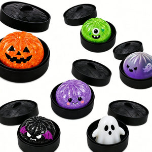 Assortment of Halloween squishy dumpling toys resting in small steamer baskets