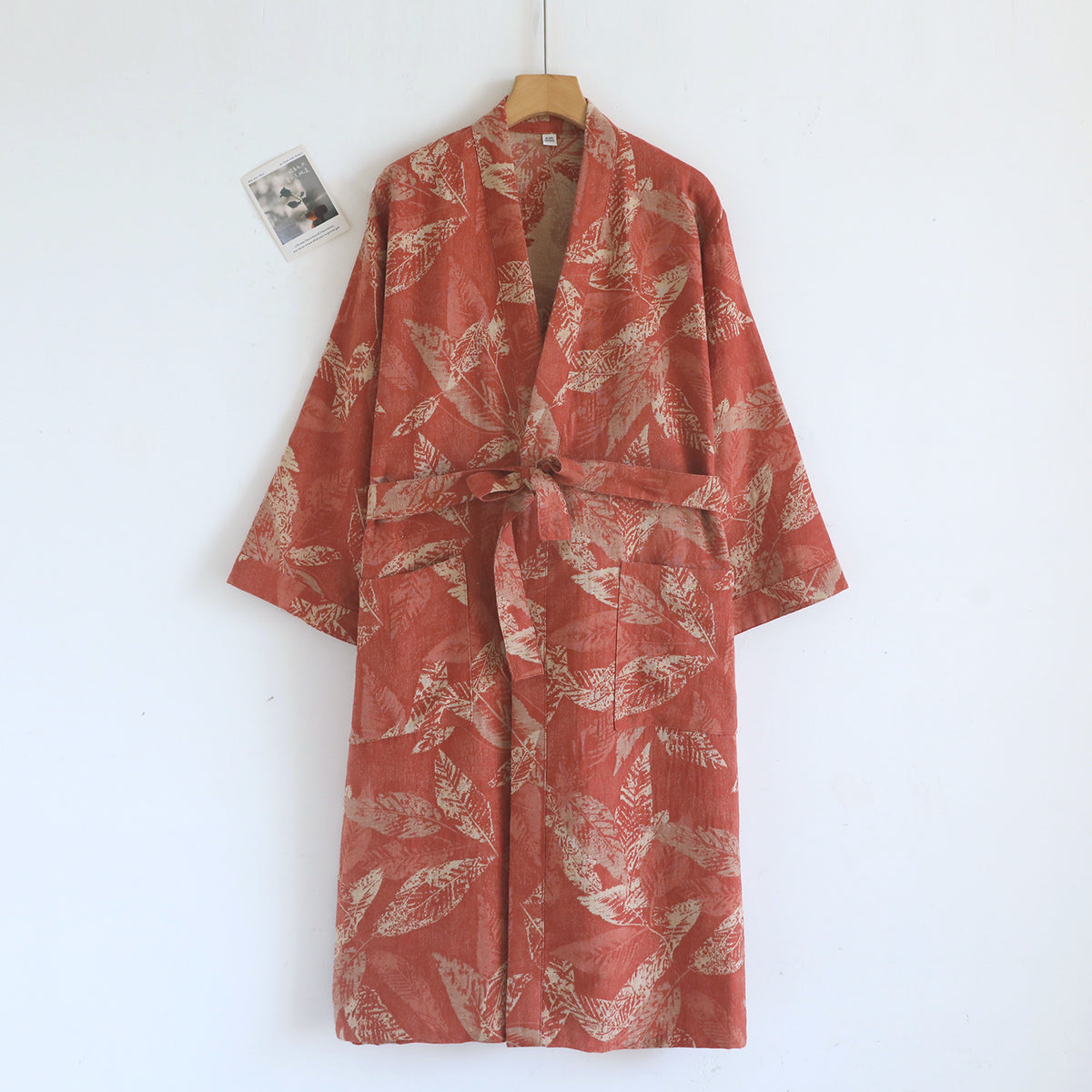 Cotton gauze kimono robe with a kimono collar and tie belt shown in a leaf print